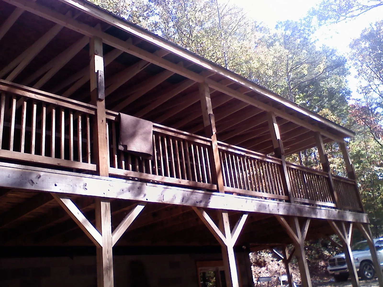 Timber framing under a new elevated porch and deck — Roof Leak Repair in Ursa by Roofing Brothers